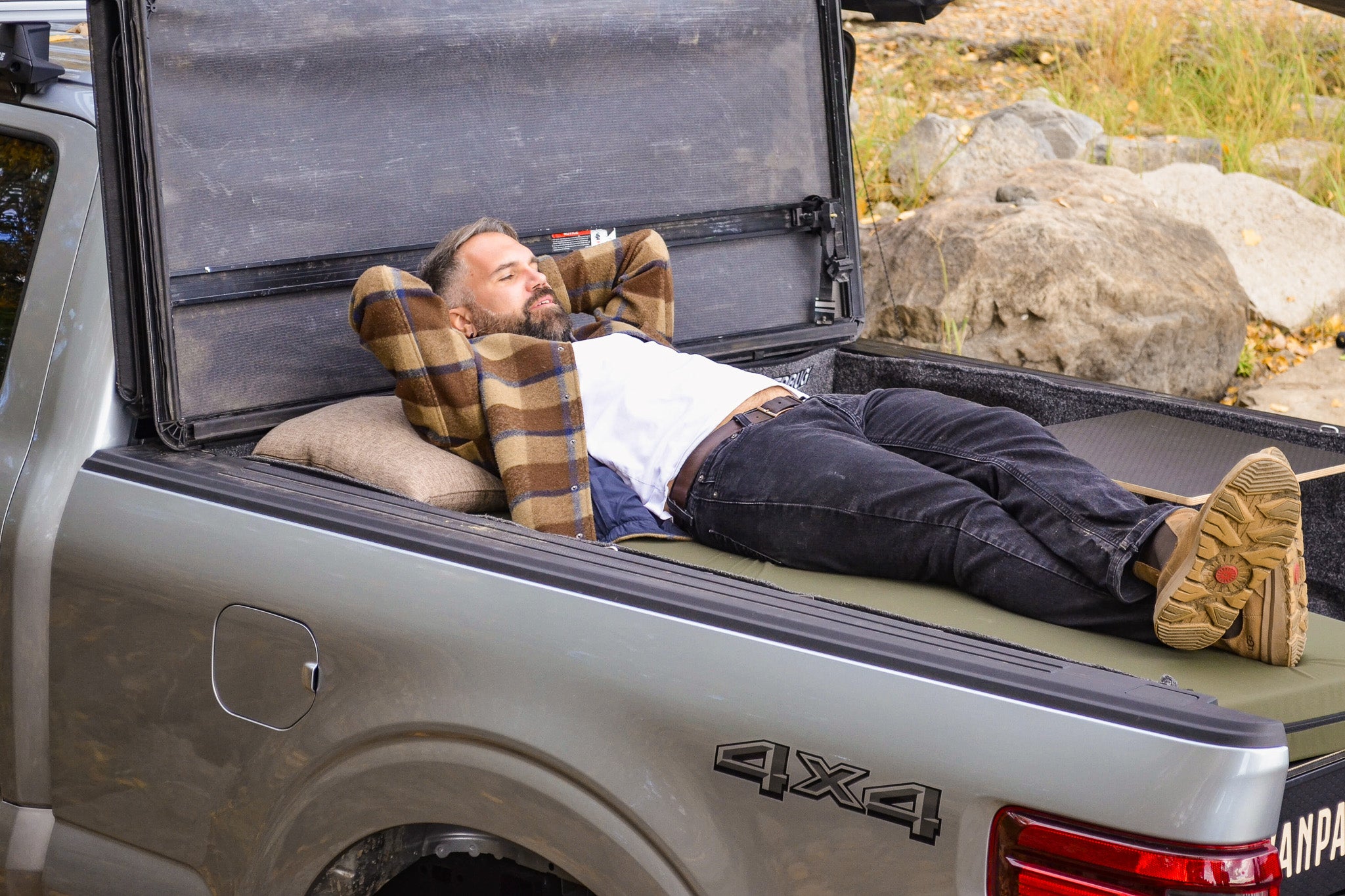 Demonstration of the single bed configuration with the pickup truck camper box.