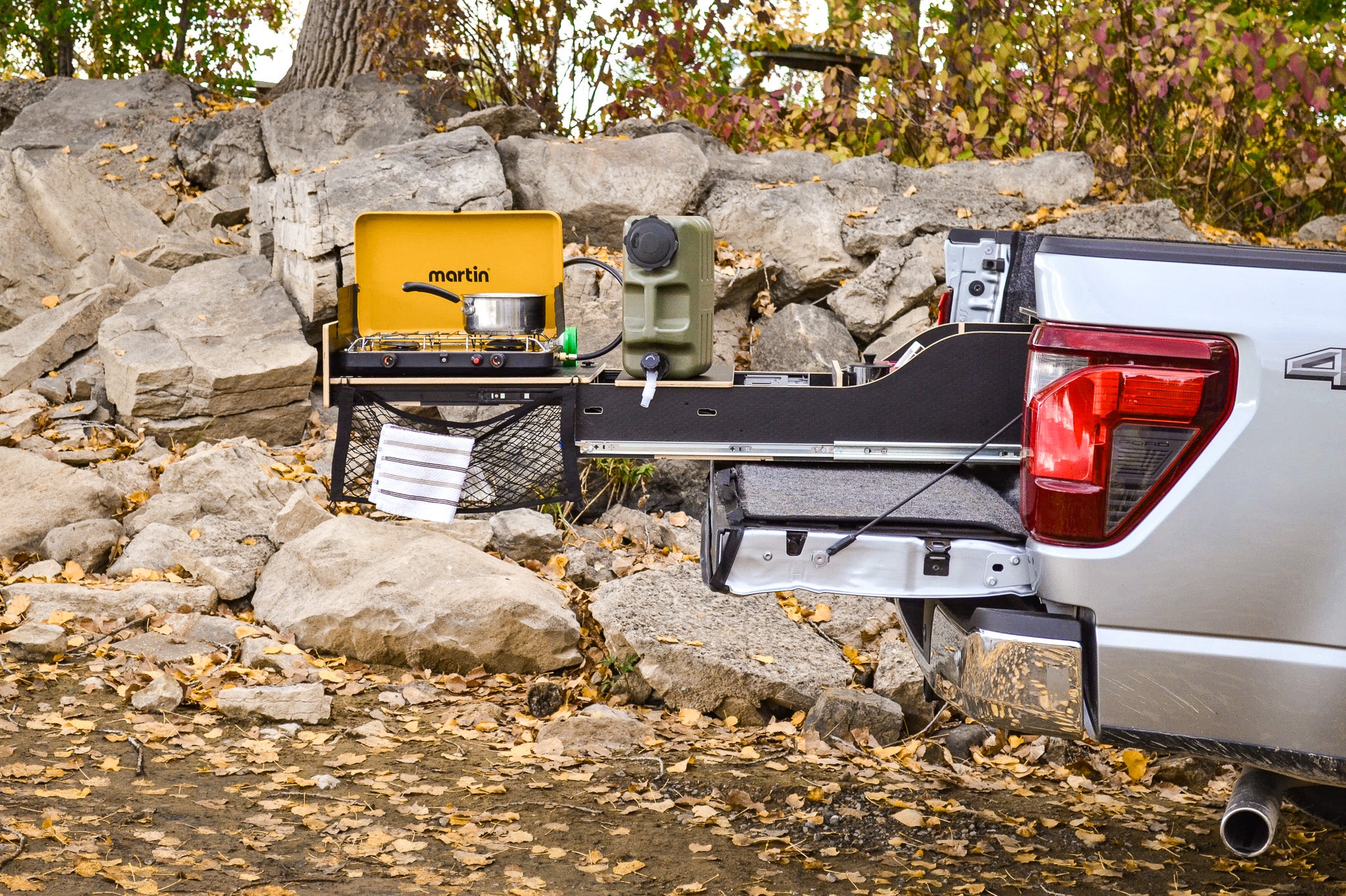 Overview of the complete kitchen setup integrated in the pickup truck camper box.