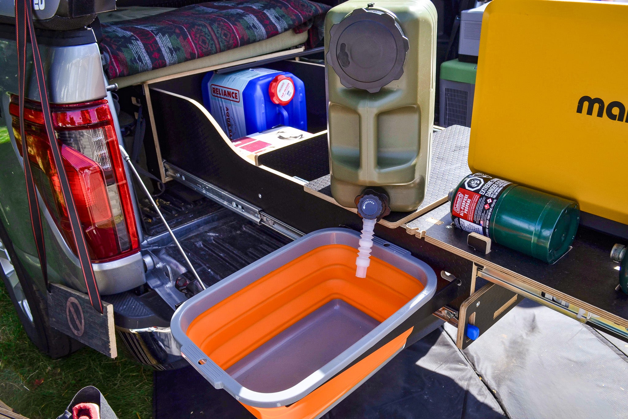 Close-up of the sink inside the pickup truck camper kitchen module.